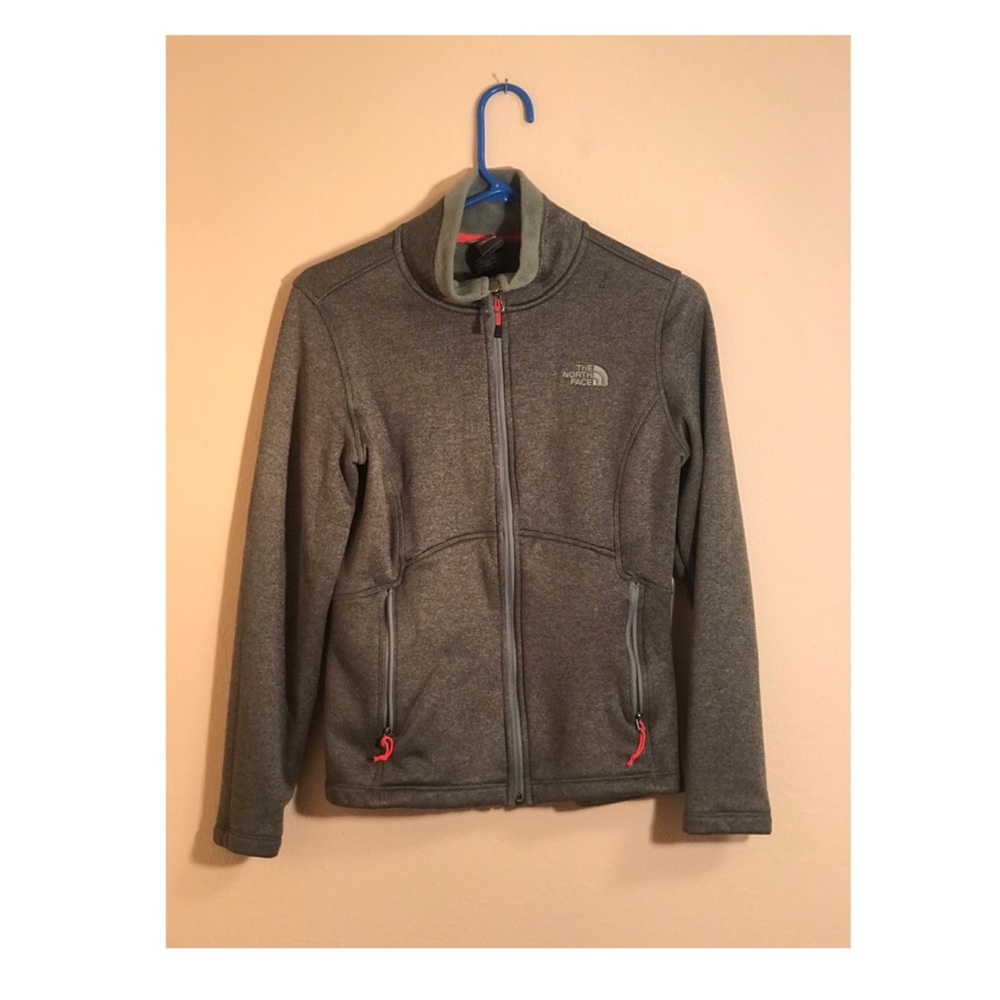 Green north face zip up jacket